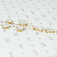 moonstone necklace in gold side view