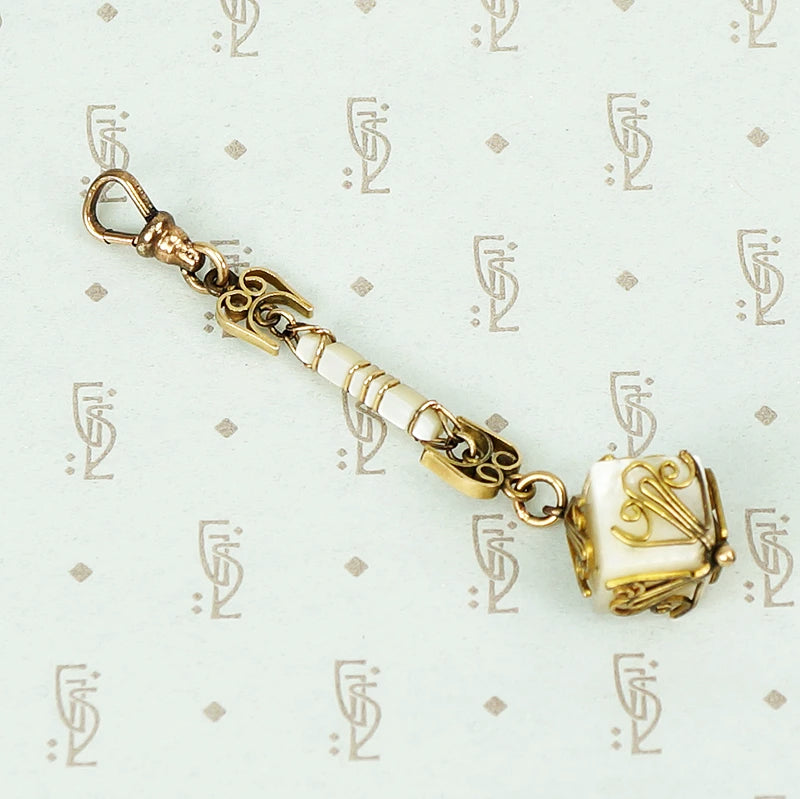 mother of pearl and gold fill fob on a hook