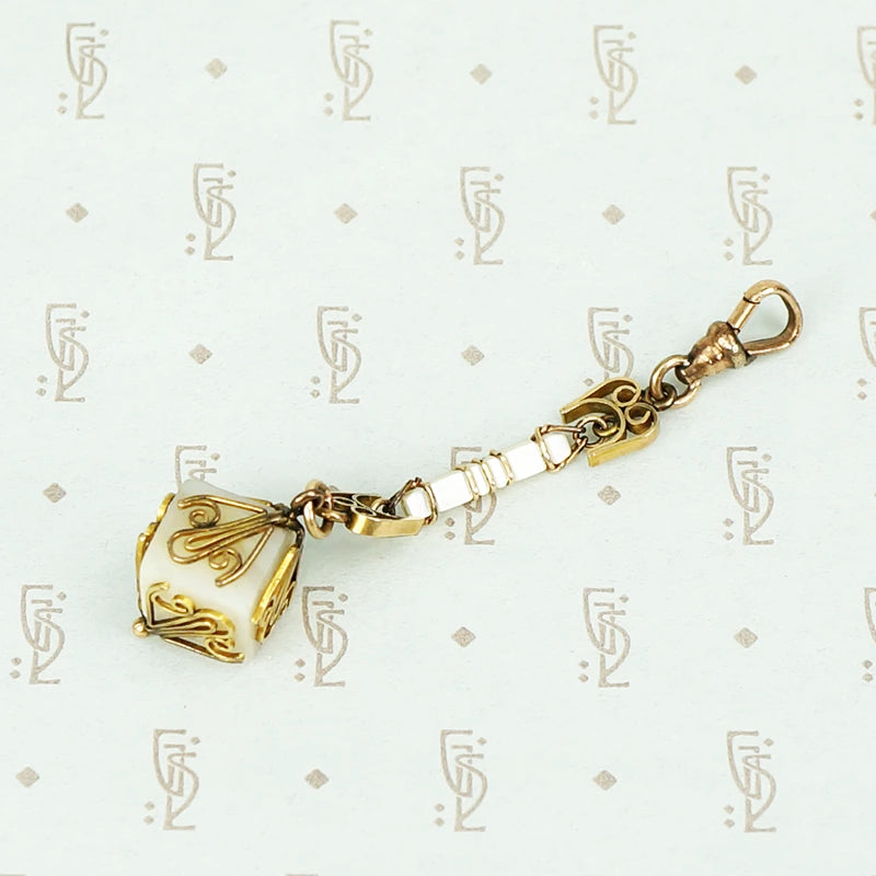 mother of pearl and gold fill fob on a hook