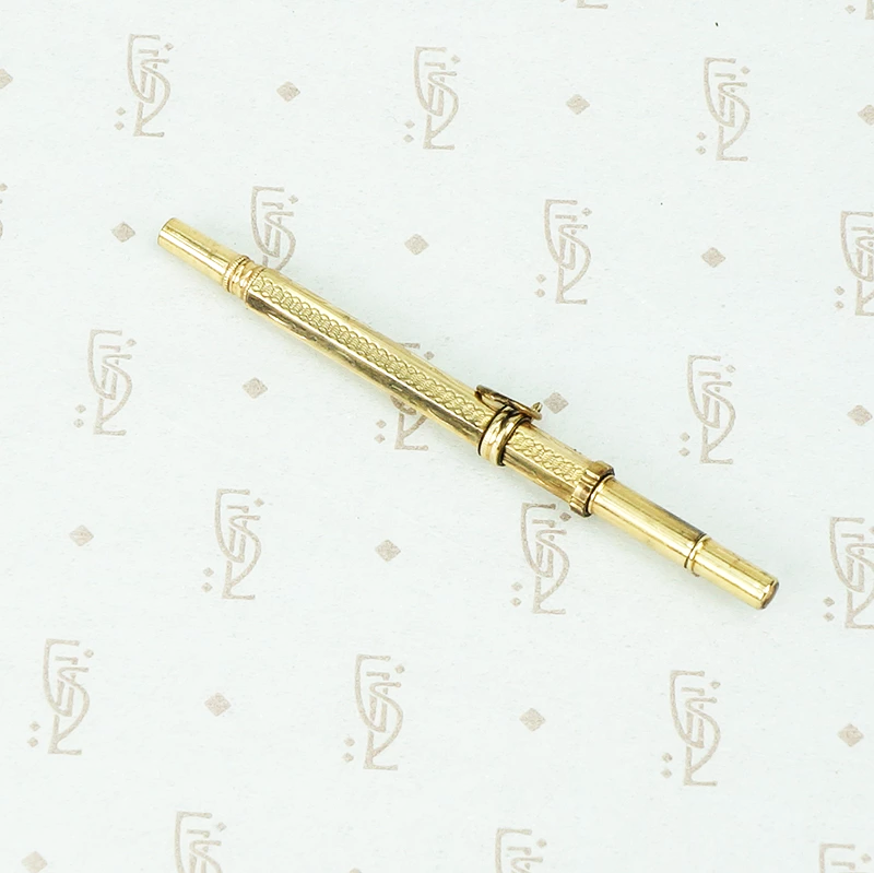 gold watch key pencil and tooth pick