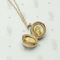 Unusual Hinged Ball Locket