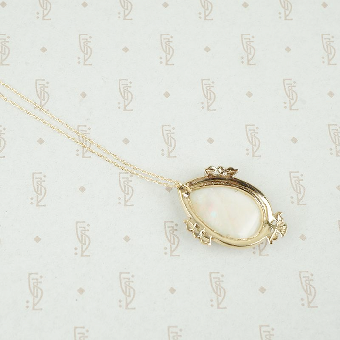 reverse of large opal pendant in gold