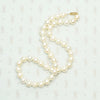 Dreamy Vintage Pearl Choker with Gold Clasp. Coiled view.