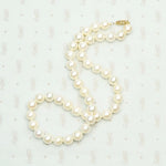 Dreamy Vintage Pearl Choker with Gold Clasp. Coiled view.