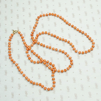 Coral Beads on White Silk Necklace