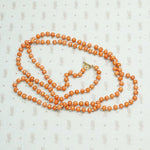Coral Beads on White Silk Necklace