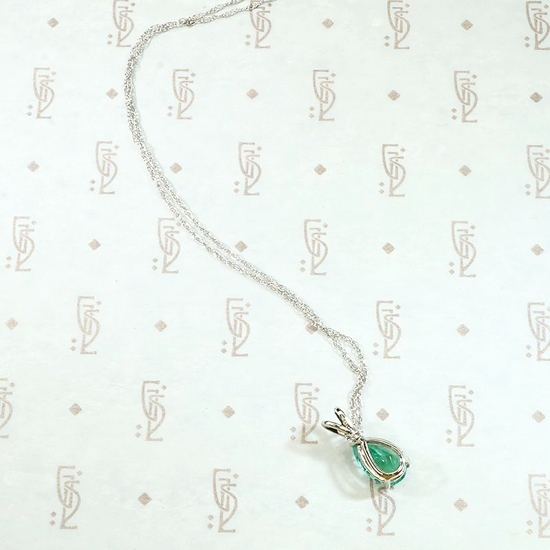 Verdant Pear Cut Emerald Pendant in White Gold