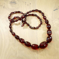 Strand of Large Faceted Amber Barrel Beads