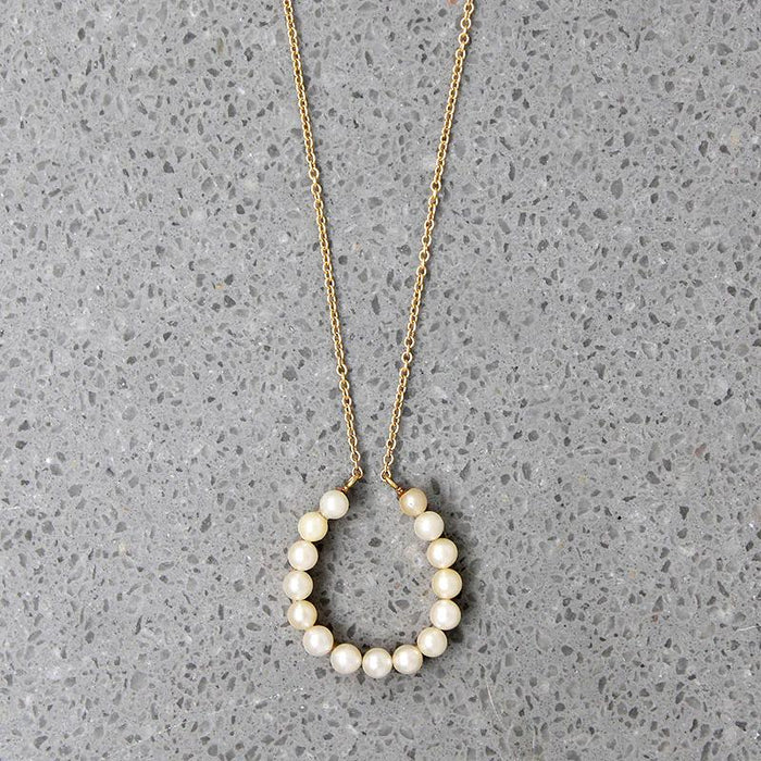 Fortuitous Pearl-Set Gold Horseshoe Pendant
