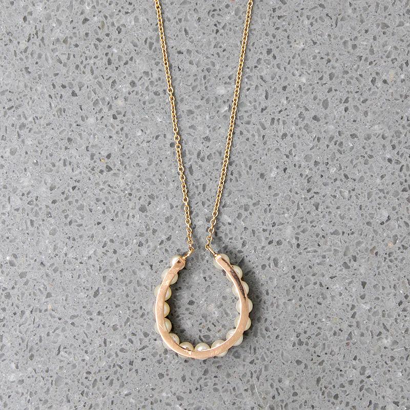 Fortuitous Pearl-Set Gold Horseshoe Pendant