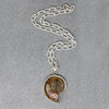 Pearlescent Ammonite Fossil in Sterling Pendant