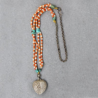 Chinese Repoussé Silver Heart Pendant on Beads