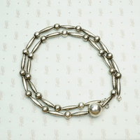 Navajo Handmade Silver Bead Necklace, coiled view.