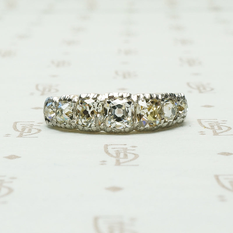 7 stone cushion cut diamond band platinum on 18k yellow gold circa 1900