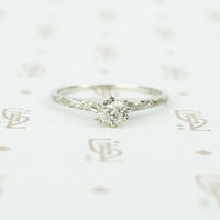engraved forget me not white gold solitaire omc diamond ring
