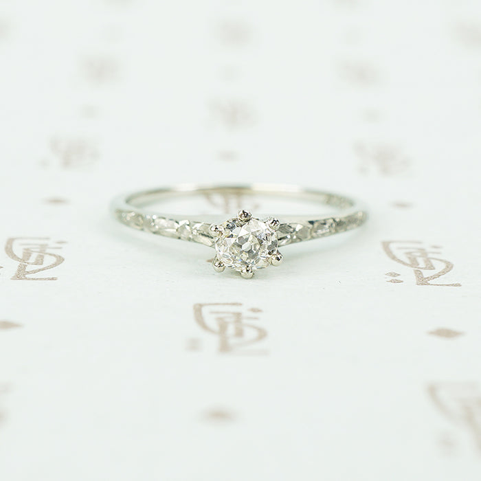 engraved forget me not white gold solitaire omc diamond ring