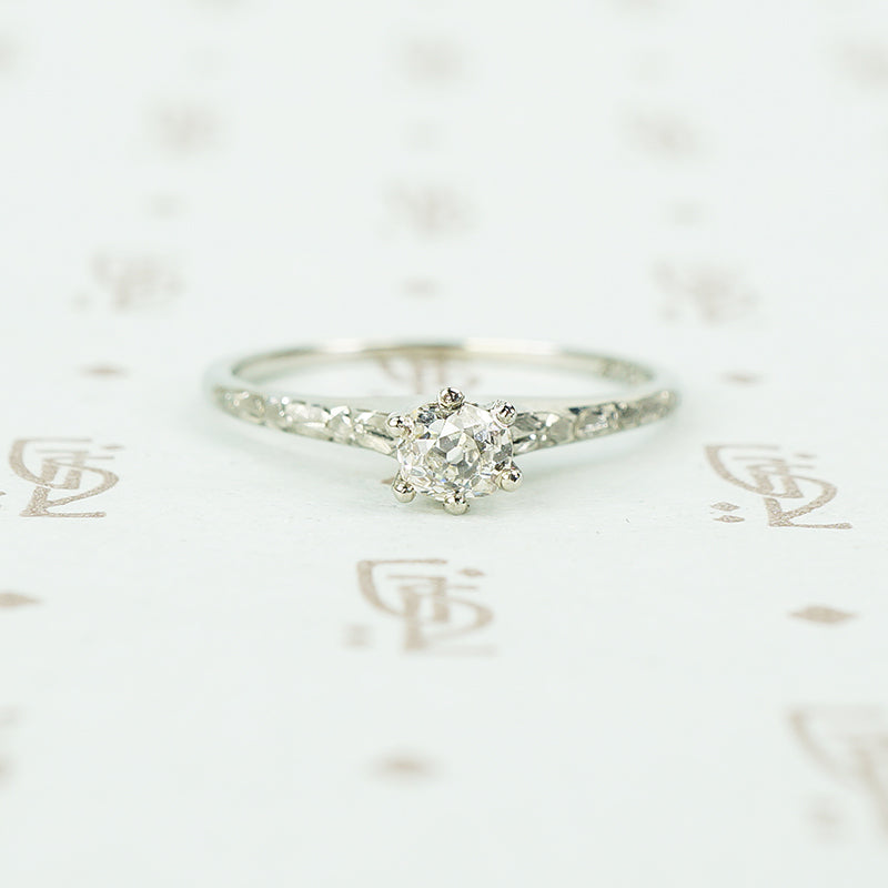 engraved forget me not white gold solitaire omc diamond ring