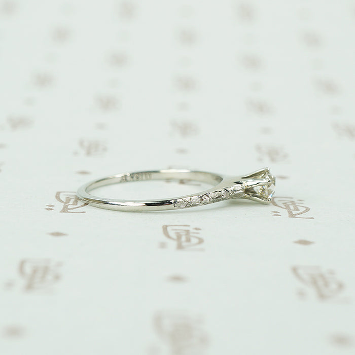 engraved forget me not white gold solitaire omc diamond ring side