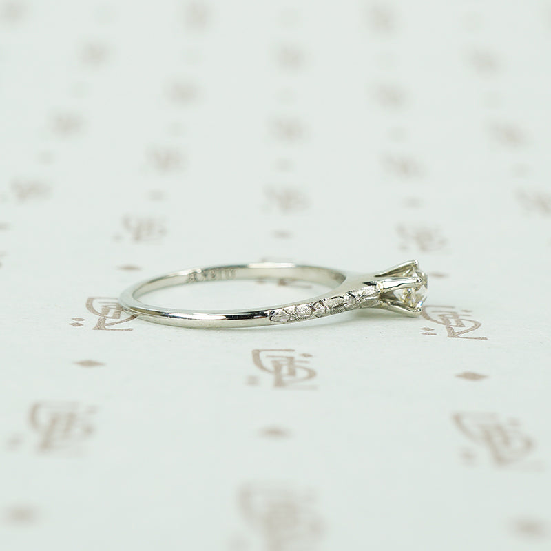 engraved forget me not white gold solitaire omc diamond ring