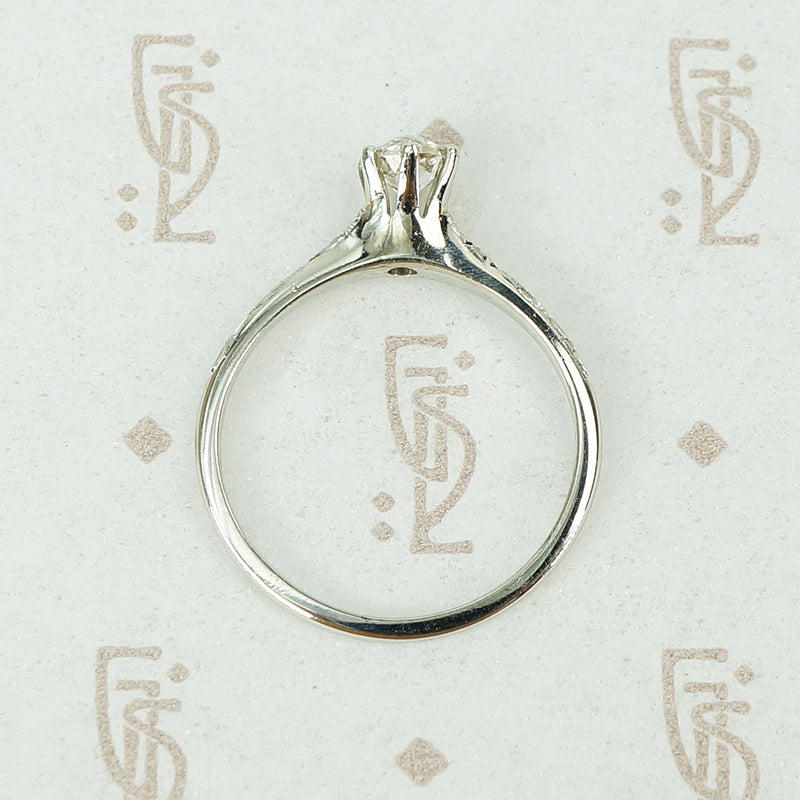 engraved forget me not white gold solitaire omc diamond ring top view