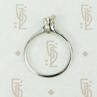 engraved forget me not white gold solitaire omc diamond ring top view
