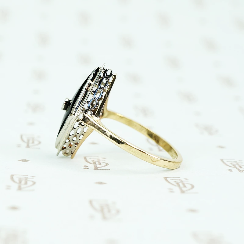 2 tone gold onyx and diamond ring side view