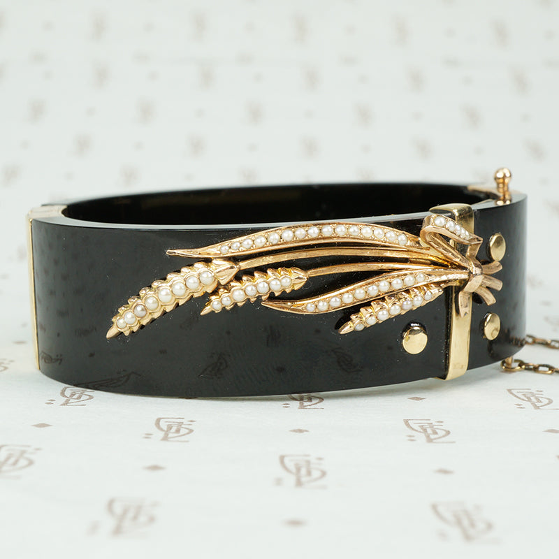 onyx bangle bracelet with a gold and pearl sheaf of wheat antique