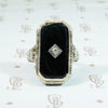 14k white gold filigree black onyx ring with a tiny diamond set in the onyx 