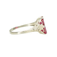 side detail view of otsby and barton white gold filigree ring set with syn ruby
