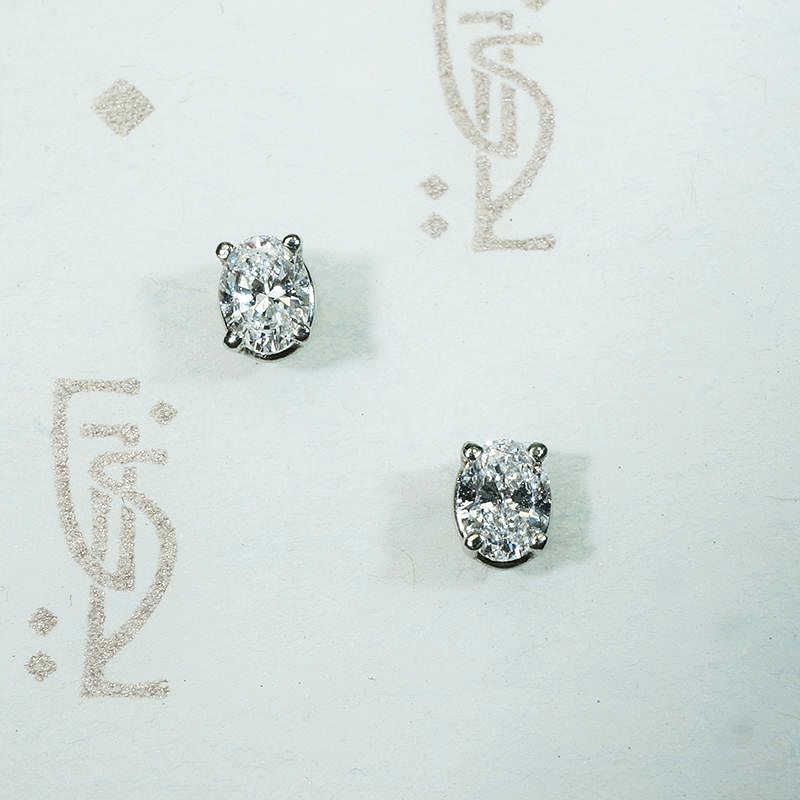 Bright Oval Cut Diamond Studs in White Gold