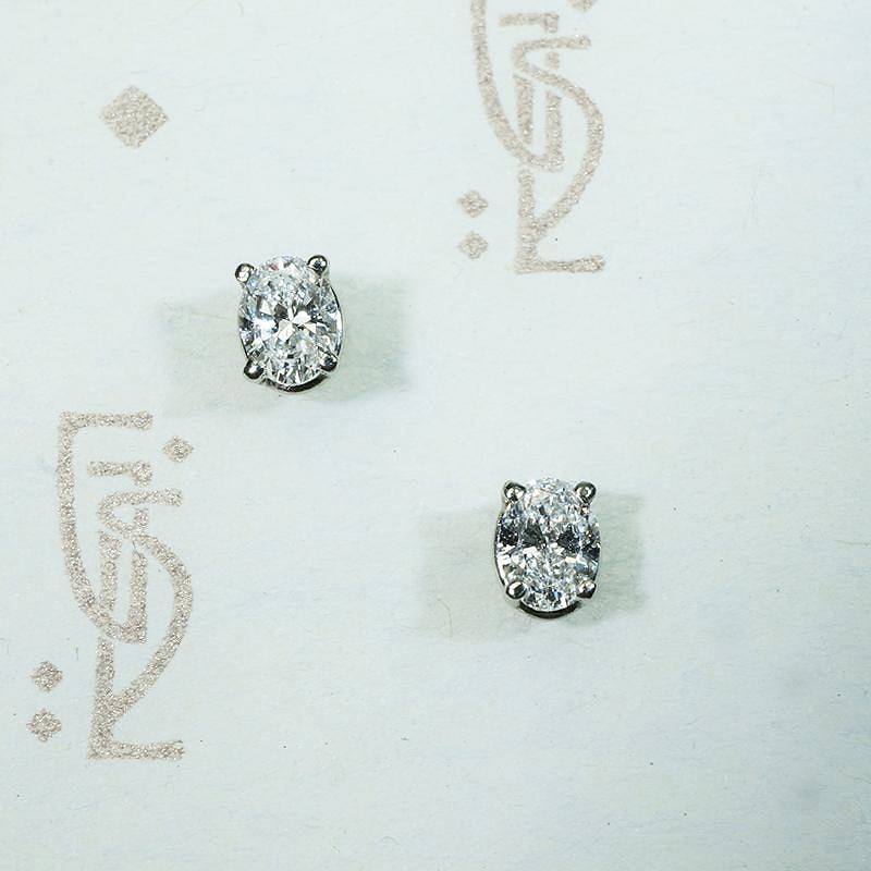 Bright Oval Cut Diamond Studs in White Gold