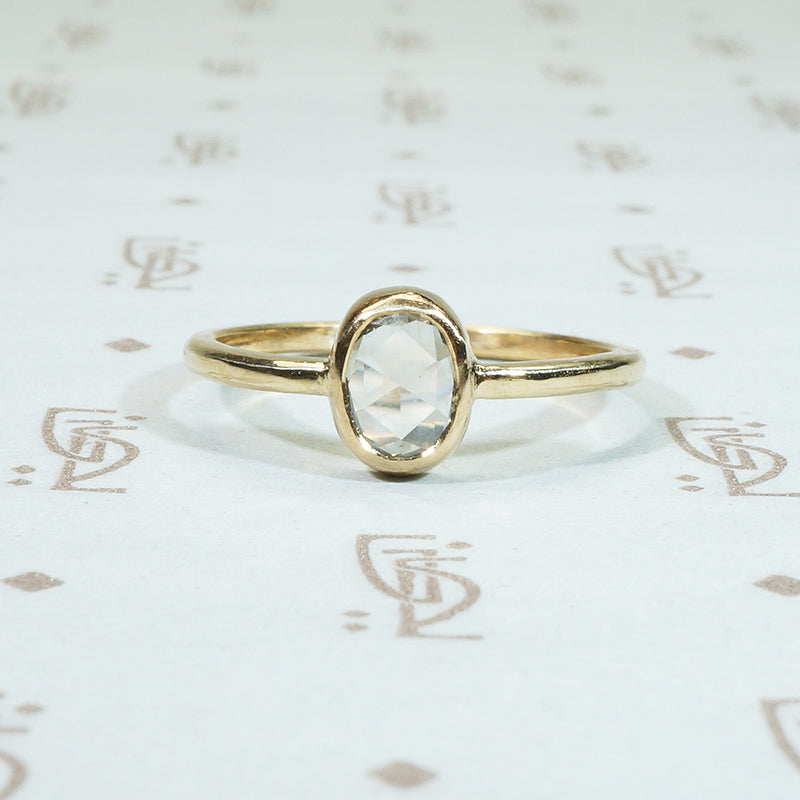 antique .45 carat oval rose cut diamond solitaire bezel set in recycled 14k yellow gold engagement ring