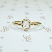 antique .45 carat oval rose cut diamond solitaire bezel set in recycled 14k yellow gold engagement ring