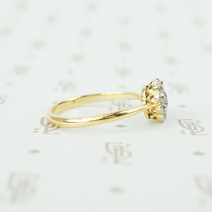 platinum on 18k yellow gold oval sapphire and diamond halo ring side view