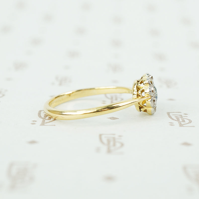 platinum on 18k yellow gold oval sapphire and diamond halo ring side view