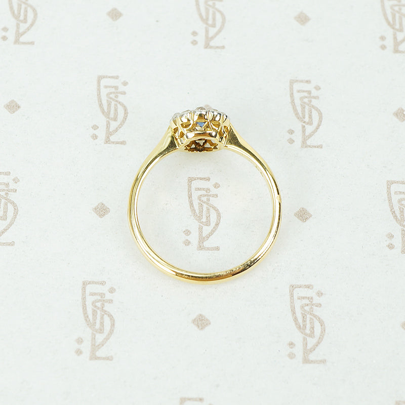 platinum on 18k yellow gold oval sapphire and diamond halo ring top view