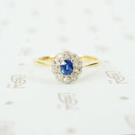 platinum on 18k yellow gold oval sapphire and diamond halo ring