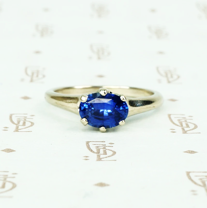 recycled white gold solitaire with oval 1.06 carat blue sapphire 