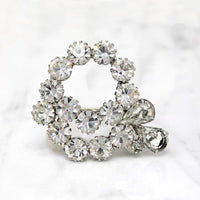Vivacious White Rhinestone Swirl Brooch