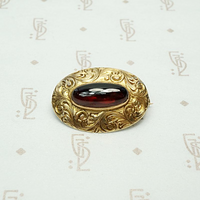 Garnet Cabochon Brooch in Engraved Gold