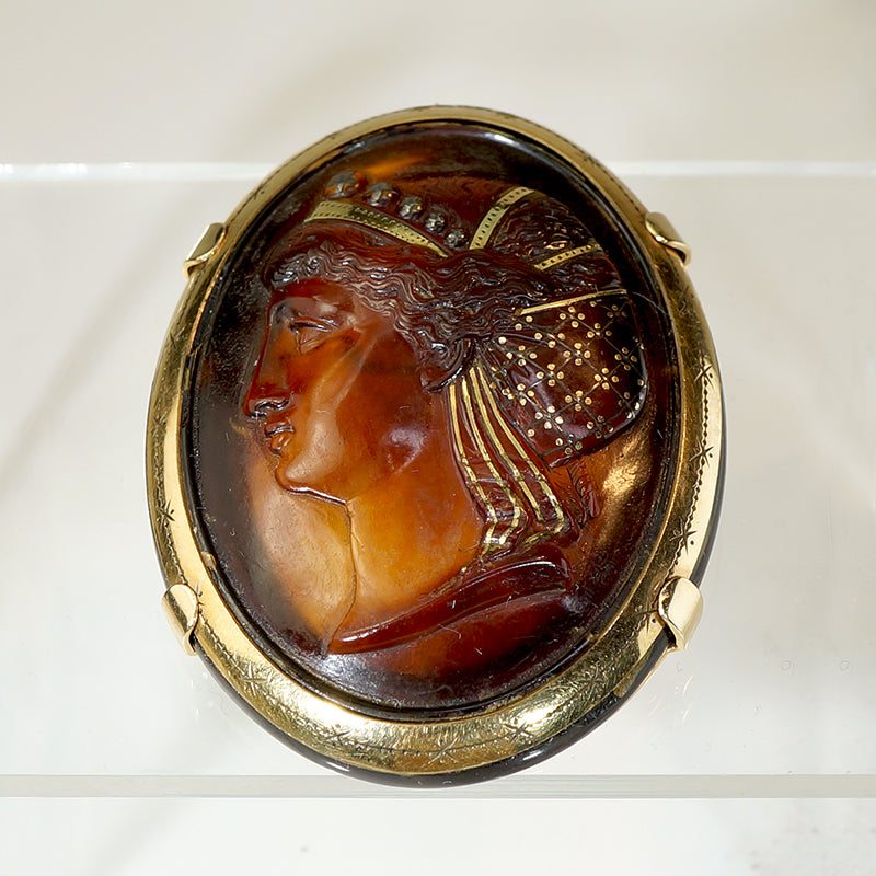 Handsome Woman with Gold Piqué Brooch