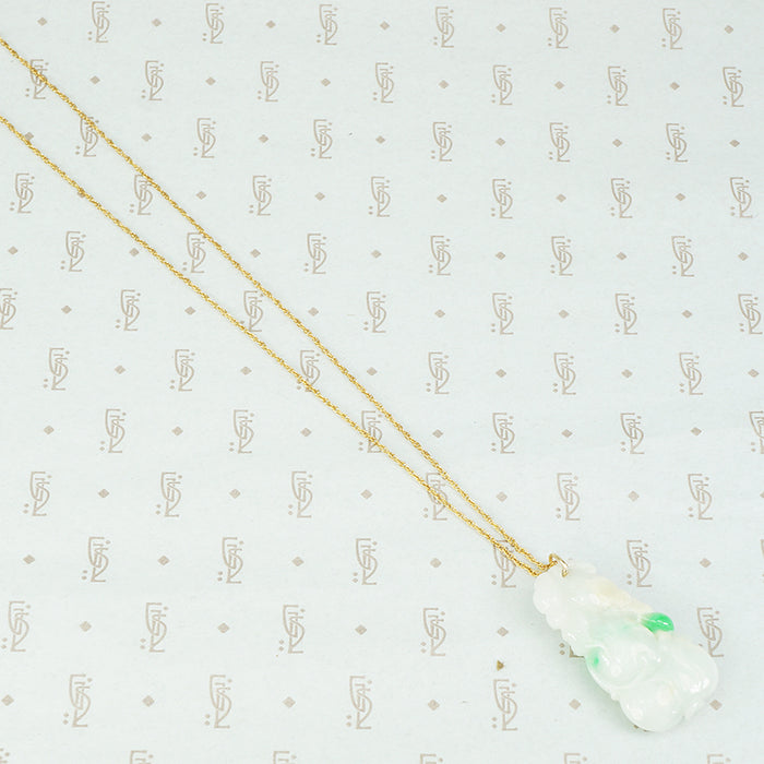 Pale green with apple green streaks carved jade pendant in the shape of plums and peaches on a gold filled chain