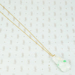 Pale green with apple green streaks carved jade pendant in the shape of plums and peaches on a gold filled chain