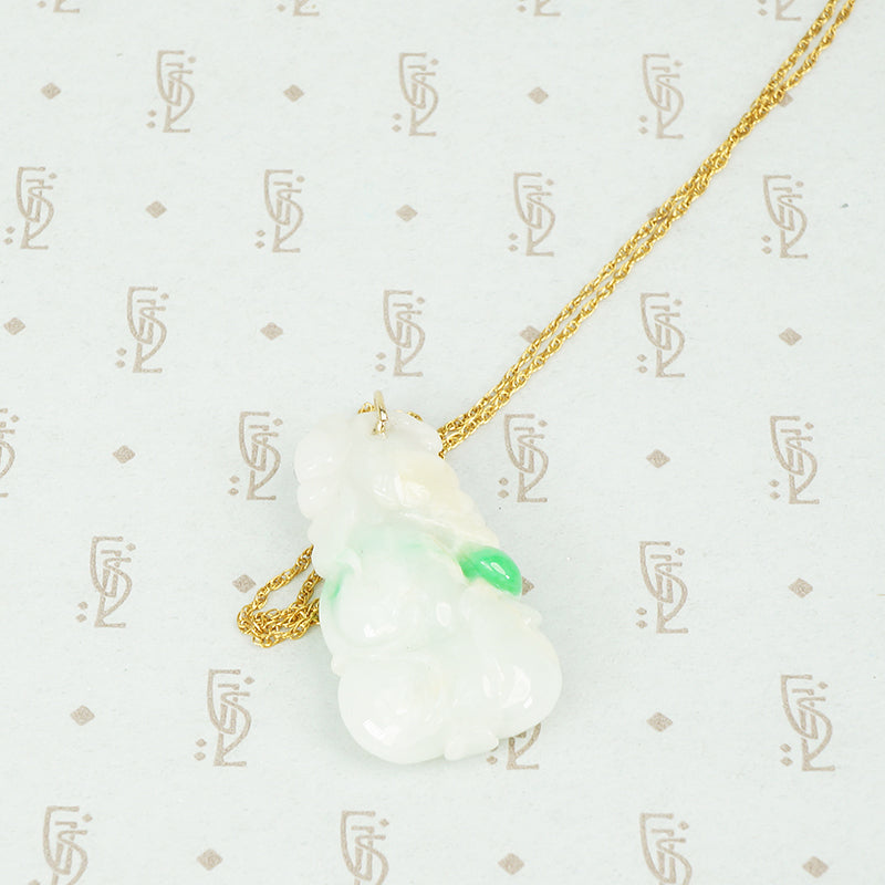 Pale green with apple green streaks carved jade pendant in the shape of plums and peaches on a gold filled chain