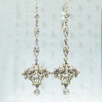 935 silver European earrings set with clear paste stones in a flower basket form with 14k gold earwires