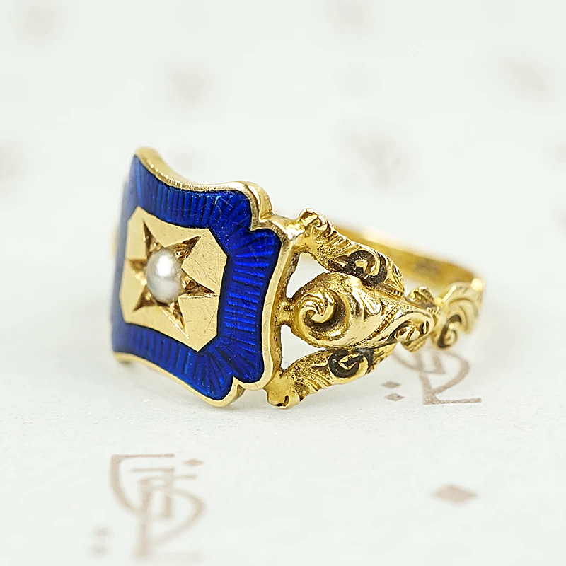 shoulder view of early gold ring featuring roses