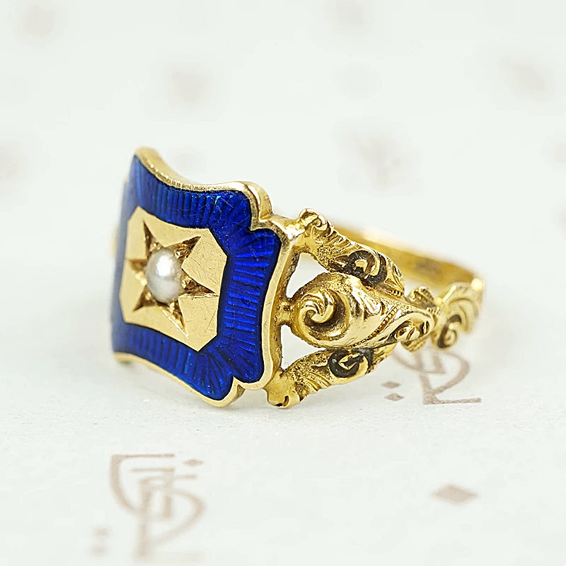 shoulder view of early gold ring featuring roses