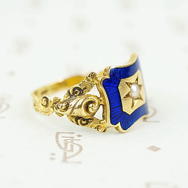 right facing shoulder view of early gold ring featuring roses