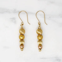 Glowing Gold Bead Bubble Earrings by brunet