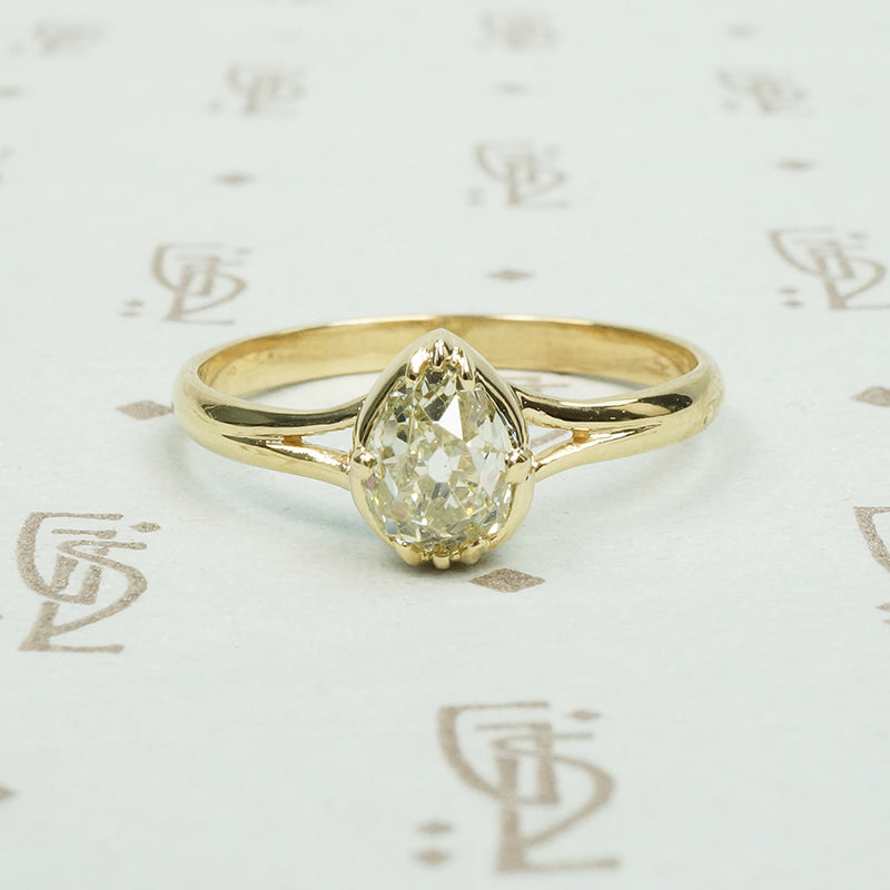 stunning .65ct old mine cut pear shaped diamond in 14k yellow recycled gold